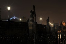 The Petrin Tower behind the Charles Bridge during the Prague Dawn Photo Tour The Petrin Tower behind the Charles Bridge during the Prague Dawn Photo Tour